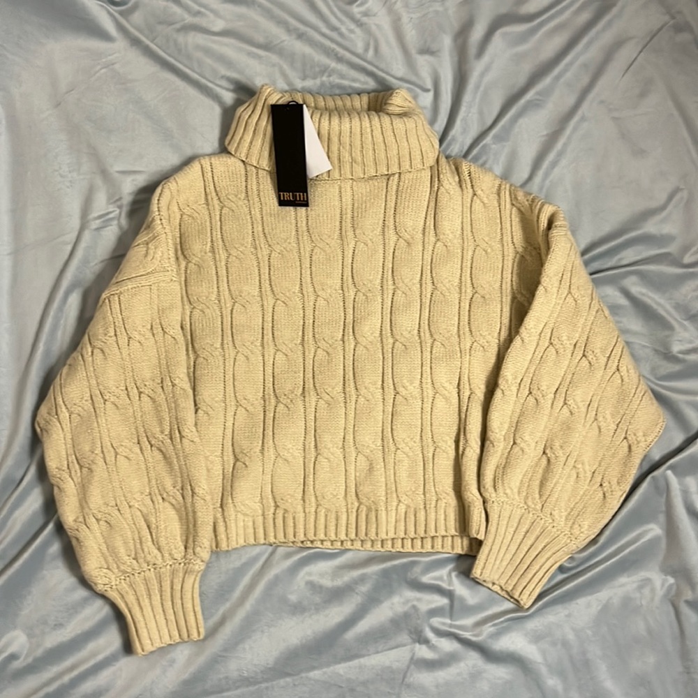 NEW WITH TAGS. perfect condition. Cream turtle neck knit sweater